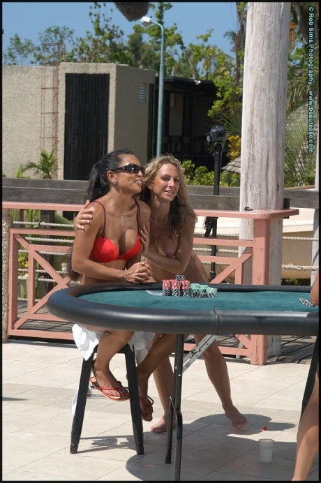 Lesbian chicks go for a skinny dip after a game of strip poker by a pool