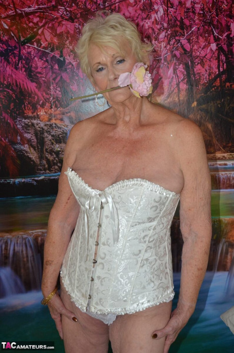 Blondie old lady Sparkle takes off a corset while getting nude in her bedroom - #6439