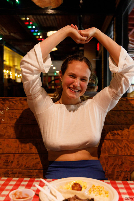 Stunning attractive babe Carrie Barber flashes an upskirt while flaunting her hot legs
