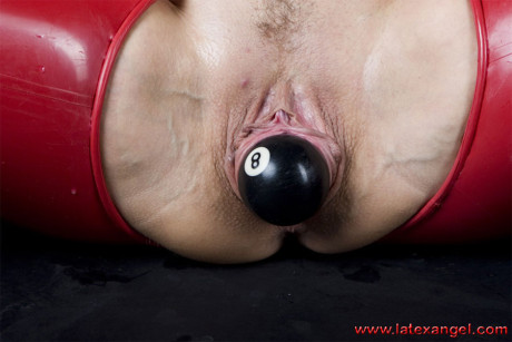 Brunette MILF sticks an eight ball into her anus while wearing latex attire - #42052