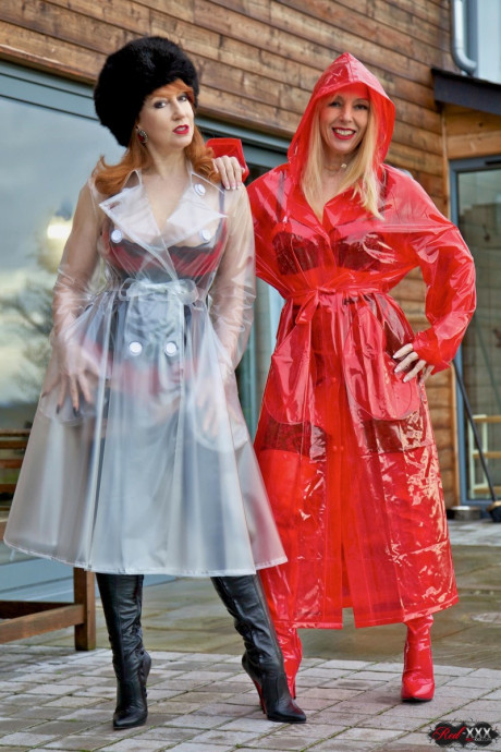 British lesbians expose boobies while modelling raincoats and thigh-high boots - #257039