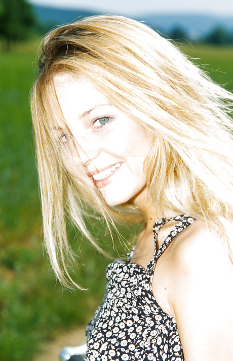 Close up outdoor posing featuring young babe Zuzana G on a bike #11424