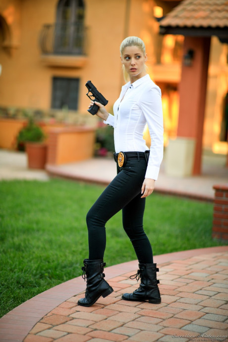 Blonde female cop strips to her black boots out on the condo walkway - #46364