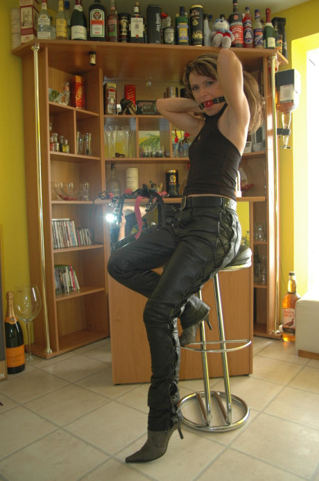 Caucasian female tries on a few ball gags while fully clothed - #105692