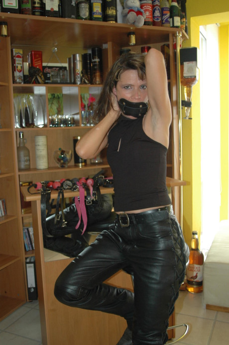 Caucasian female tries on a few ball gags while fully clothed - #105702