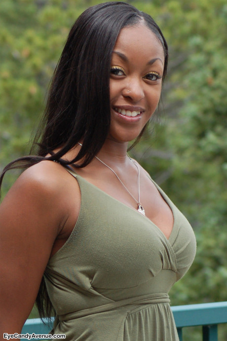 Ebony amateur Amber releases her giant boobies from a long dress on a balcony - #100198