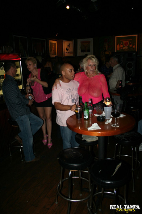 Insatiable swinger wives show off their huge boobs and lick hard dongs in public - #21657