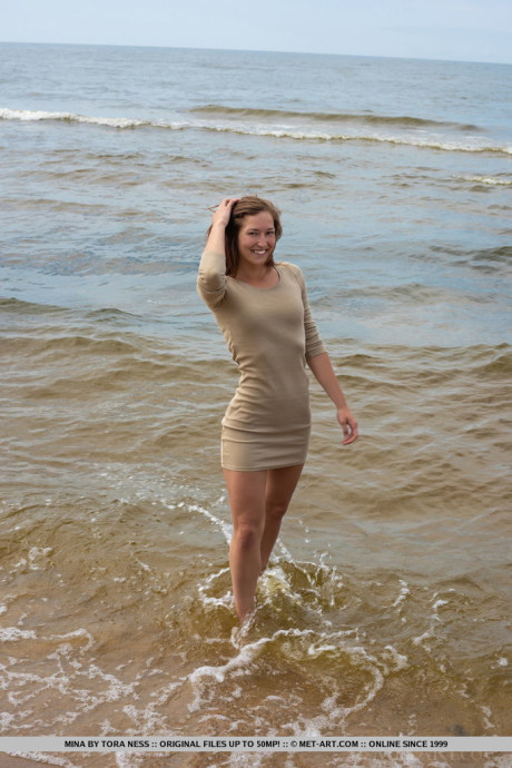 Tall teenie Mina hangs wet clothes to dry while posing naked on a beach - #52008