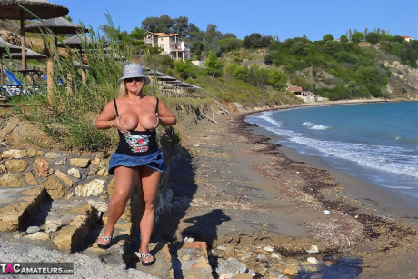 Hugely busty mature lady Chrissy swims and lounges at the beach stark naked - #182323