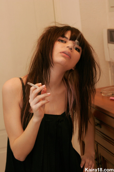 Petite young Kaira 18 smokes a cigarette before stripping naked - #47657