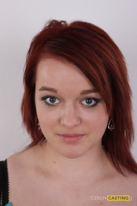 Redheaded amateur Tereza exposes a tattoo above her pussy while getting naked - #92281