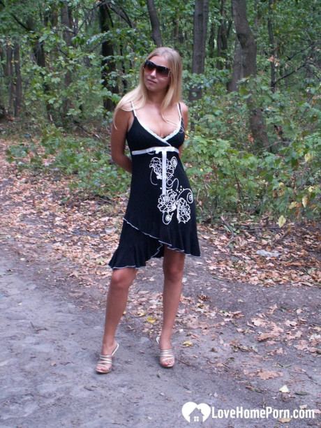 Naughty yellow-haired strips undressed & shows off her tanned breasts outdoors - #224900