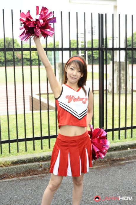 Japanese cheerleader Tomomi Matsuda gives a demonstration at a playground - #190887