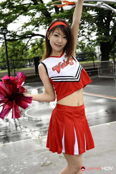 Japanese cheerleader Tomomi Matsuda gives a demonstration at a playground - #190890