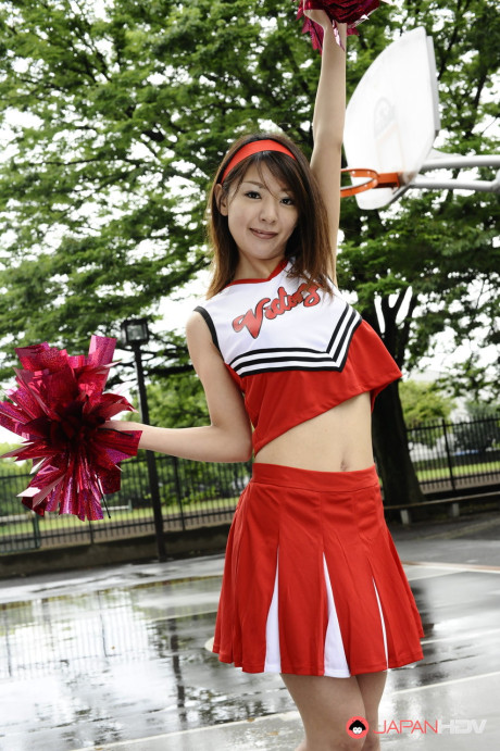 Japanese cheerleader Tomomi Matsuda gives a demonstration at a playground - #190891