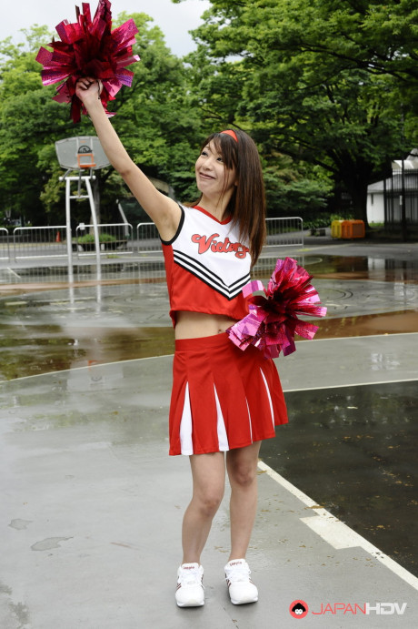 Japanese cheerleader Tomomi Matsuda gives a demonstration at a playground - #190897