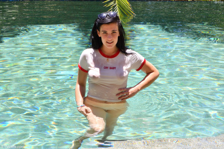 Young slut GF girl with black hair mounts a dildo before showing her bare butt in a pool - #43125