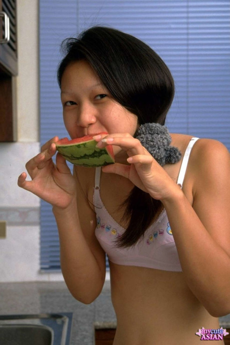 Sweet asian young removes lace lingerie while eating a watermelon - #221669