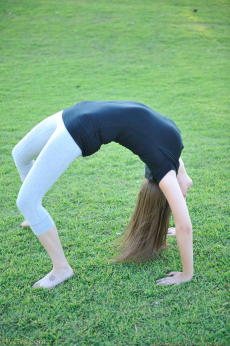 Amateur beauty with glasses Orianna gets naked while doing exercises outdoors - #160911