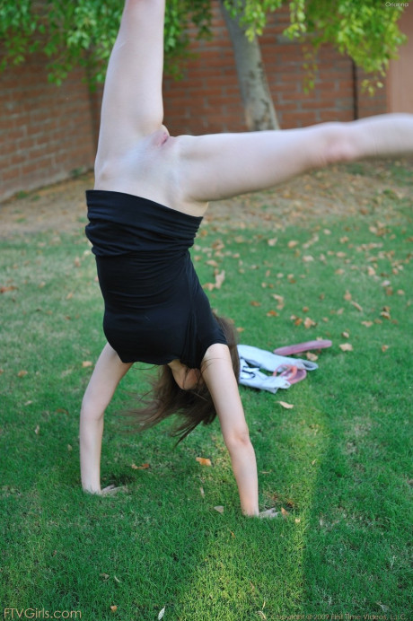 Amateur beauty with glasses Orianna gets naked while doing exercises outdoors #8824