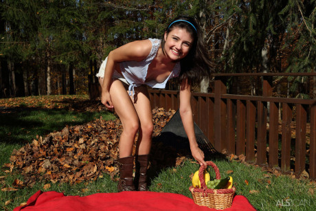 Charming teen Adria Rae pauses from raking leaves to slip a cucumber up her pussy - #33755