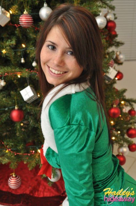 Amateur Xmas elf Hailey lifts her tight skirt to show her lovely behind by the tree - #231819