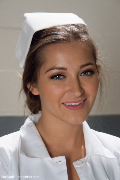 Beautiful nurse with a nice behind Dani Daniels strips and poses in high heels - #255680