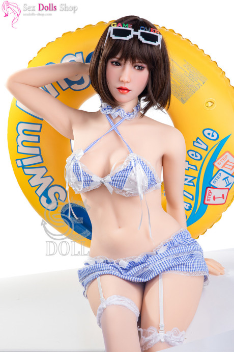 Gorgeous dark-haired sex doll shows off her amazing breasts & her curvy behind - #7185
