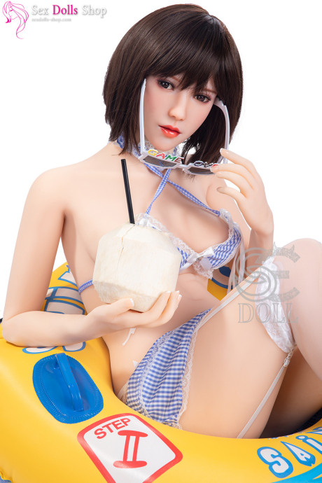 Gorgeous dark-haired sex doll shows off her amazing breasts & her curvy behind - #7189