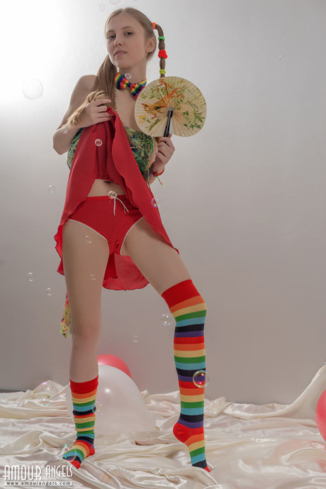 Thin young lady gf chick in pigtails and multi-colored socks takes off her clothes - #2258