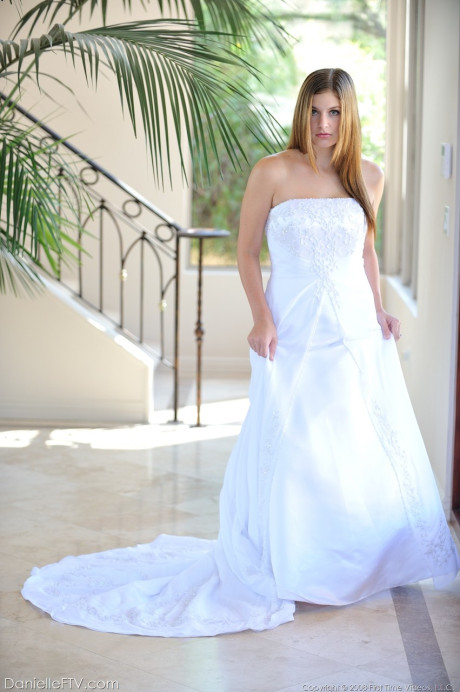 Busty glamorous amateur Danielle models wedding gown indoors & by the pool - #218933
