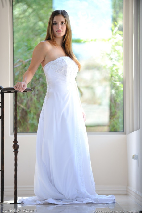 Busty glamorous amateur Danielle models wedding gown indoors & by the pool - #218934