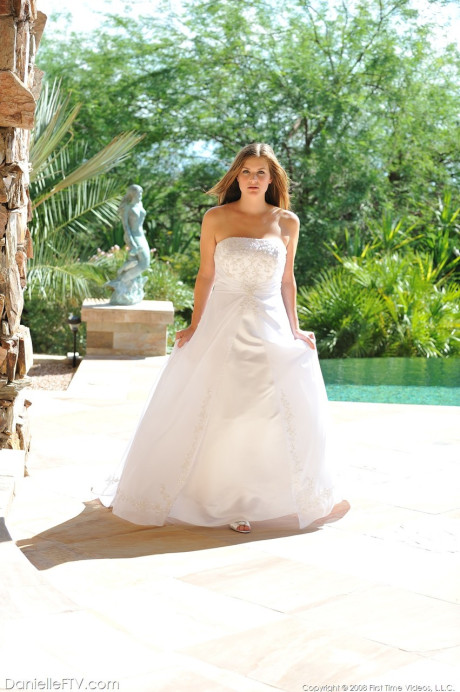 Busty glamorous amateur Danielle models wedding gown indoors & by the pool - #218945