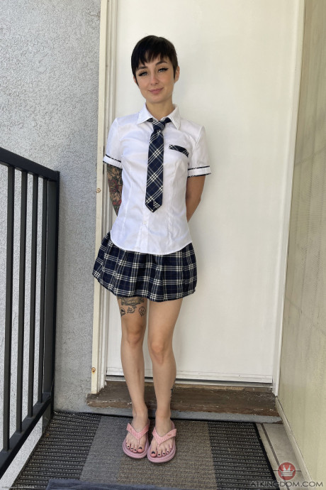 Brunette schoolgirl Stevie Moon spreads her shaved puffy snatch up close
