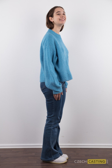 Amateur model Uliana stands nude after removing a sweater and blue jeans - #137915