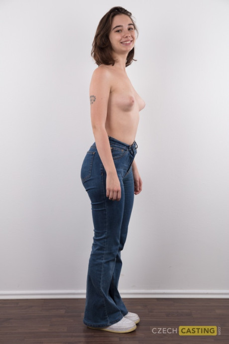 Amateur model Uliana stands nude after removing a sweater and blue jeans - #137918