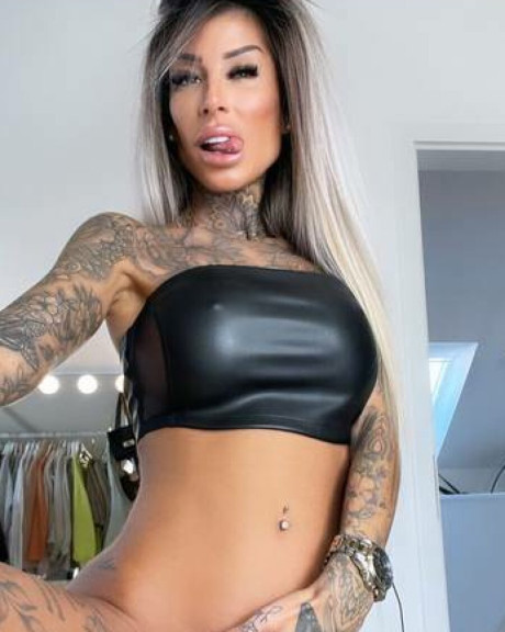 Tattooed amateur teases with her gorgeous curves in hot outfits - #56161