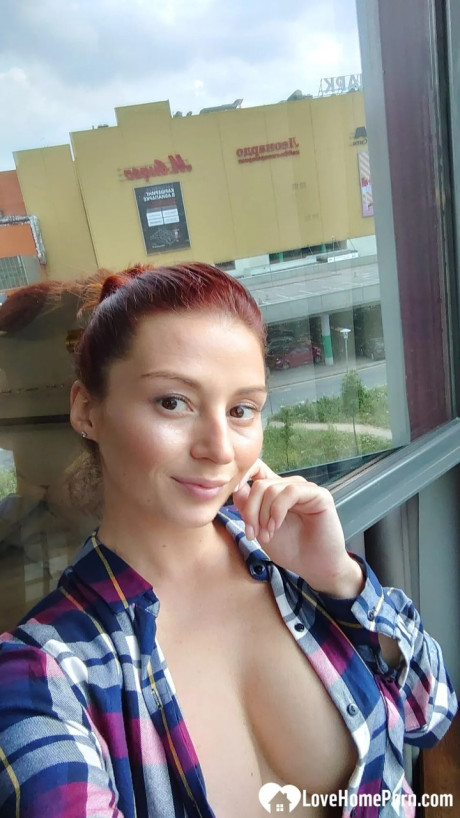 Pretty red hair shows off her big melons & her tattoos while taking nudes - #27093