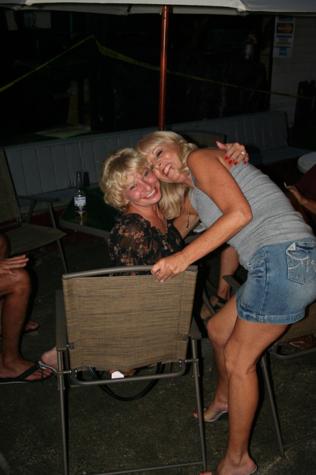 Kinky swinger wives French kiss and pose provocatively at a party - #123018