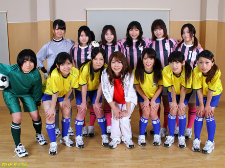 Oriental female football team watches as a teammate gets nailed by the referees - #42371