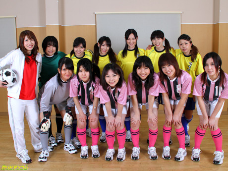 Oriental female football team watches as a teammate gets nailed by the referees - #42372
