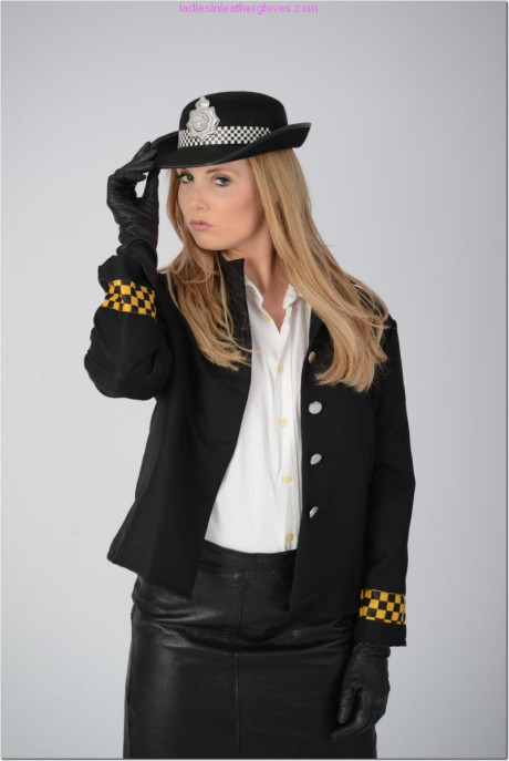 British policewoman Louise removes her clothing to stand undressed in gloves - #179925