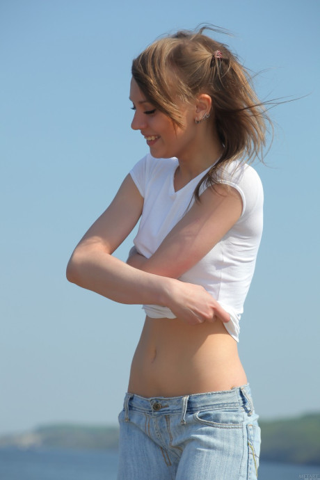 Hot young with a slim body Avril B reveals her fine titties by the sea - #82819