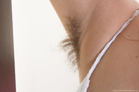 Attractive teenie Baby Lizza shows off her unshaven armpits and damp beaver - #24160