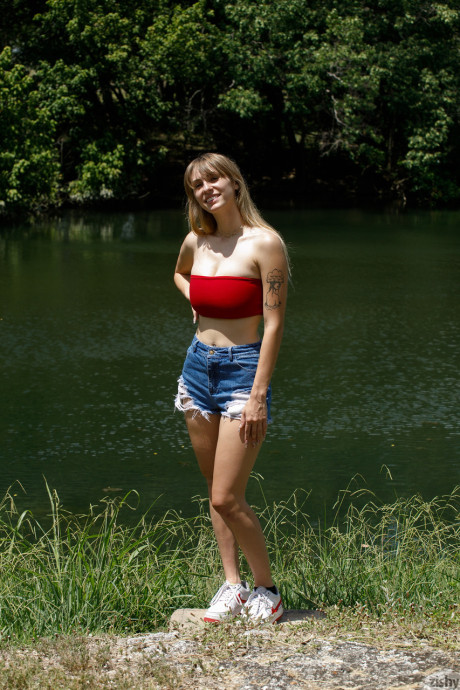 Sweet babe in behind shorts Angel Youngs shows off her juicy titties outdoors - #196710