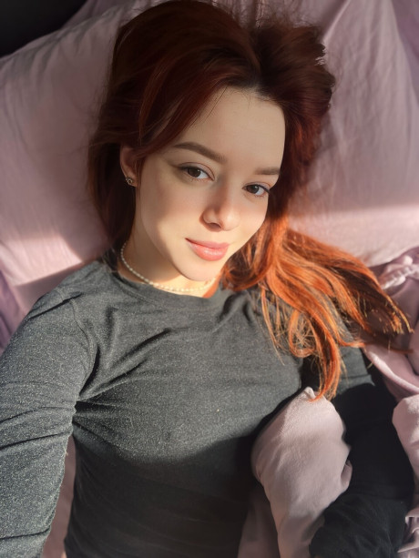 Sexy redhead Sofi Foxxxy shows her huge tits on a bed in a red thong - #217699