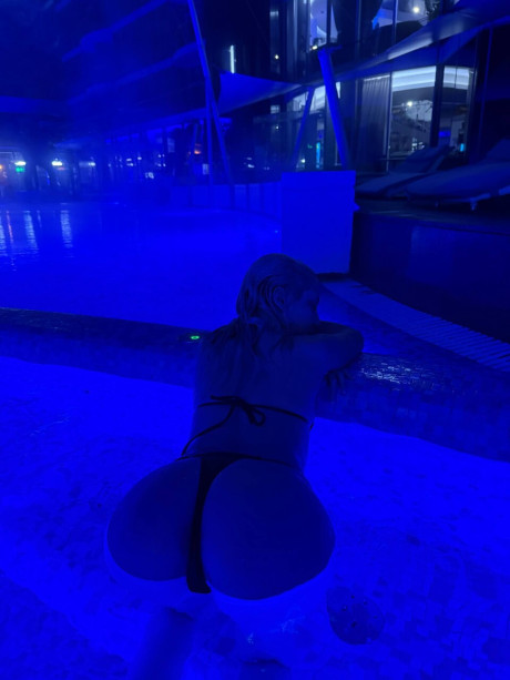 Blondy teen gets undressed on a bed after swimming in a pool at night - #274775