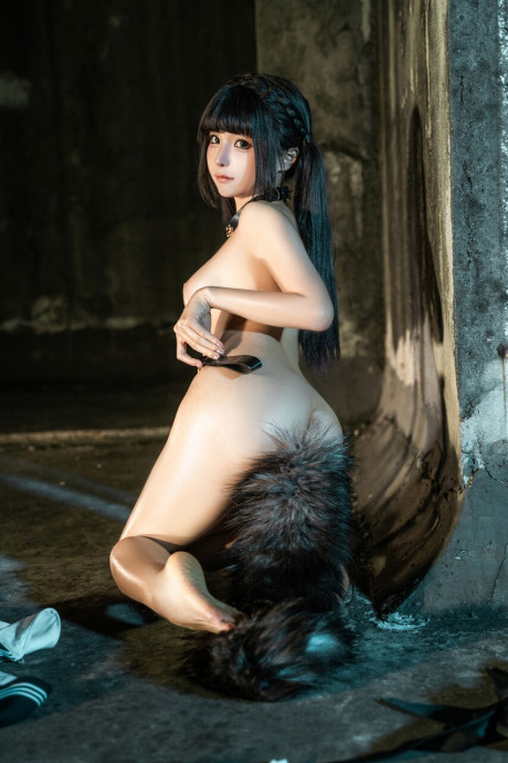 Gorgeous lovely oriental skank girl girl sports a hairy tail butt plug while posing solo