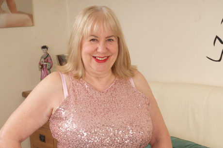 Old blondy Speedy Bee finger spreads her snatch on a bed in tan nylons - #269834