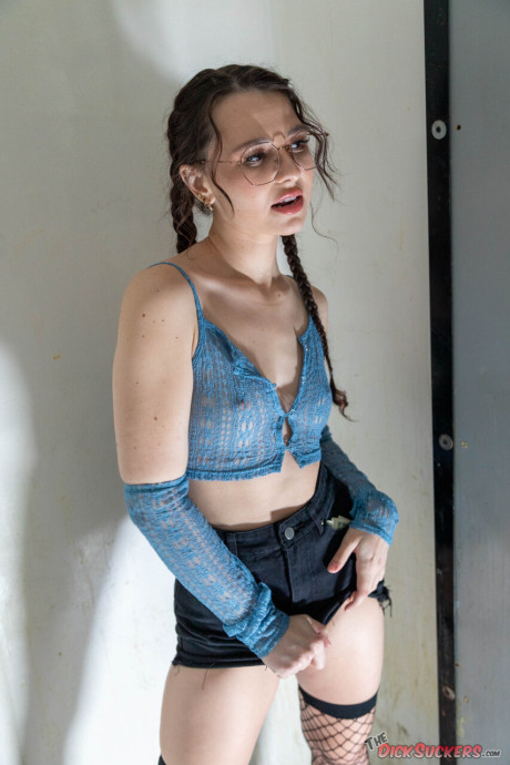 Liz Jordan wears her glasses while taking part in a blowbang at an adult store
